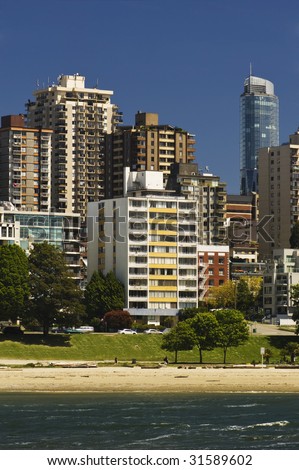 Apartments face the water and beach in the city.