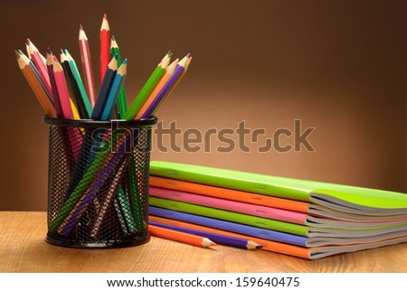 Set of pencils and notebooks