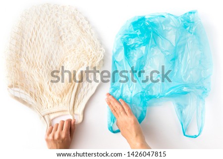 Similar – Image, Stock Photo Eco net reusable tote bag for environment friendly grocery shopping, hanging on a door knob. Neutral color zero waste and recycling  concept.