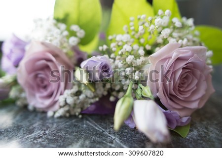 Wonderful bouquet with pink, white and purple flowers with green leaves in the background