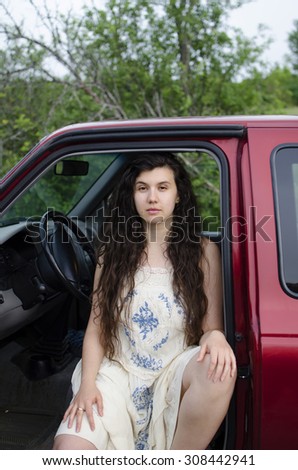 Woman sitting in truck