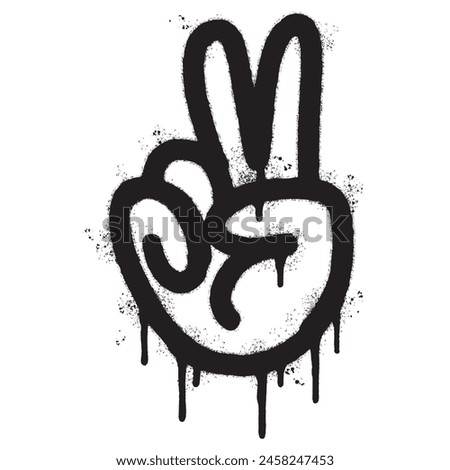 Spray Painted Graffiti Hand gesture V sign for victory icon Sprayed isolated with a white background. graffiti Hand gesture V sign for peace symbol with over spray in black over white.