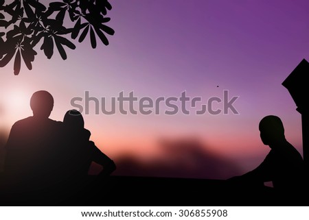 Silhouette love Couple and one man on Beautiful evening  sunset above the mountain in Thailand