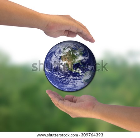Protect or save world or earth by two hand on over blur forest background. world photo from NASA
