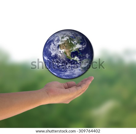 Planet in human hands or Protect or save world or earth by hand on over blur wood at Thailand background. world photo from NASA
