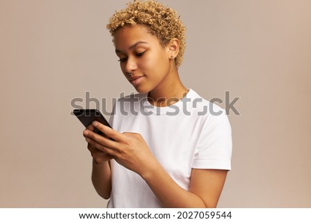 Similar – Image, Stock Photo Afro woman using mobile with an orange wall