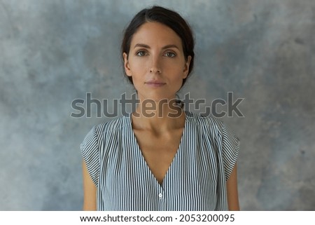 Similar – Image, Stock Photo Serious female with makeup and freckles on nose gently and looking at camera