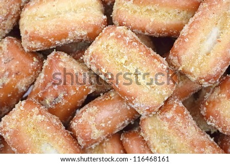 Looking down at a close view of honey mustard flavored pretzel pieces.