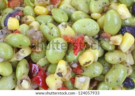 A close view of edamame soy bean salad in oil.