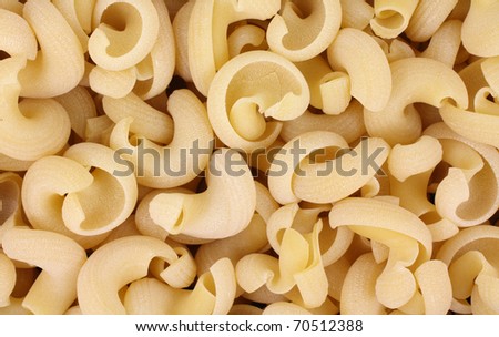 A close view of swirl shaped wheat pasta.
