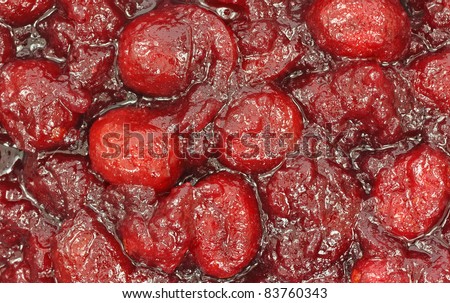 A close view of canned cranberry sauce with whole berries.