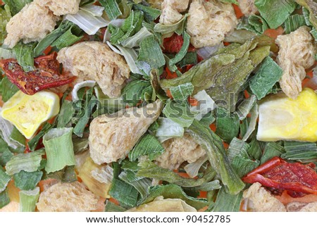 A close view of dried vegetables  and chicken.