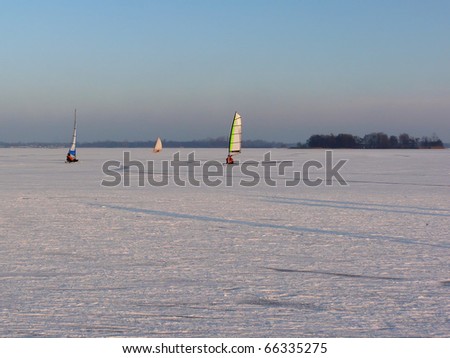 Ice sailing on a frozen lake in winter in the Netherlands.
