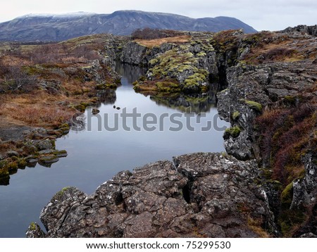 Thingvellir, a fissure in the earth\'s crust where the european and american continents slowly drift apart. It\'s also the place where the first Icelandic parliament seated.