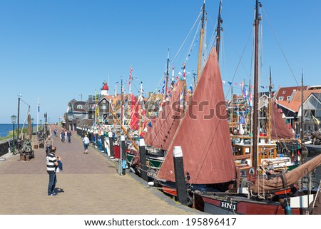 URK, THE NETHERLANDS - MAY 31: Fishing day with decorated traditional fishing ships on May 31, 2014 in the harbor of Urk, the Netherlands