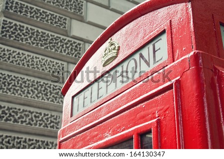 Red Telephone Booth in London street day time