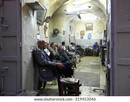 JERUSALEM OLD CITY, 1 APRIL 2013. Editorial Photo of Men Smoking. Smoking is a much enjoyed part of the social culture in much of Asia, though studies highlight health risks due to toxic emissions