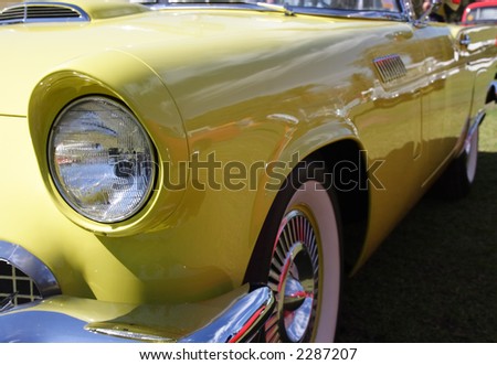 Front headlight view of a yellow car