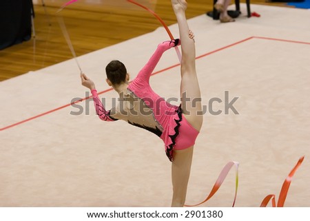A female competitor in a Rhythmic Gymnastics event