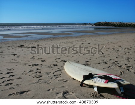 surf board on the sand of a surfer beach
