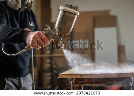 Professional carpenter varnishing wood for modern furniture, joinery and woodwork concept Foto stock © 