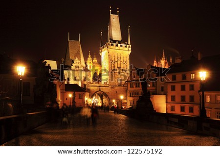 The night View on Prague Lesser Town with Charles Bridge, St. Nicholas\' Cathedral, Bridge Tower and gothic Castle, Czech Republic