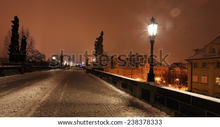 Night romantic snowy Prague Old Town from Charles Bridge, Czech republic