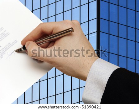 The Signature of Business Contract in front the Skyscraper