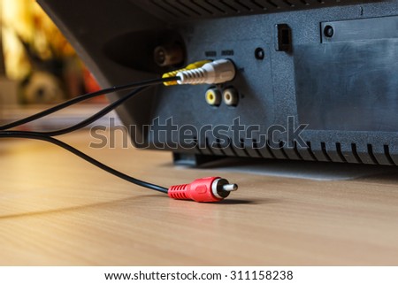 TV jack plugged in 2 hole. Only red is not plugged. Focus on the red jack.
