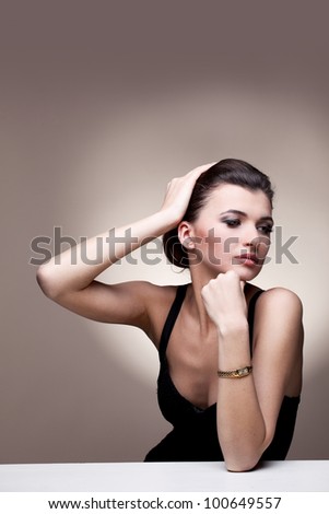 Portrait of luxury woman in exclusive jewelry watch on natural background