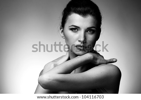 Black and white portrait of luxury woman in exclusive jewelry on natural background