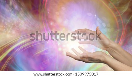Sending you beautiful healing energy vibes - female cupped hands with white energy formation flowing outwards, sparkles and colours moving in all directions with copy space
 ストックフォト © 