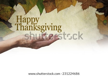Happy Thanksgiving Parchment Autumn Leaves banner - Woman\'s outstretched hand with palm up and a \'Happy Thanksgiving\' floating above on a parchment background edged with autumn leaves fading to white