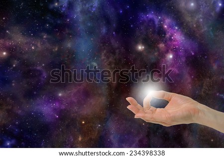 Gyan Mudra Hand Position creating the Spark of Life on a deep space background with planets, stars, suns, clouds and plenty of copy space