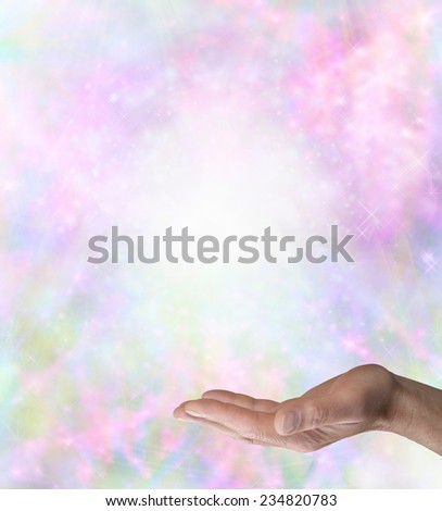Spiritual Message Board Background    Male hand outstretched palm up with hand surrounded by delicate glittering stars and a pastel colored background with plenty of copy space above