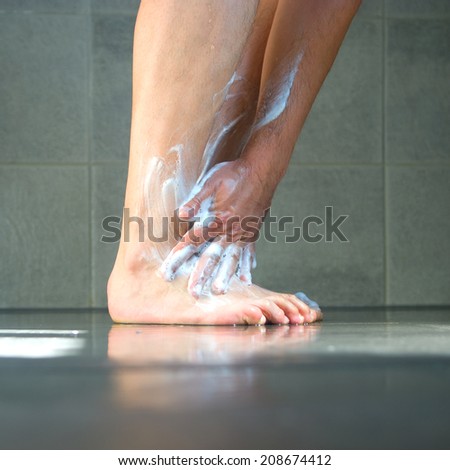 Close up of wet legs and hands.