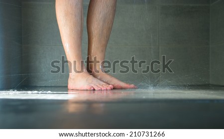 Closeup of wet legs in the bathroom.