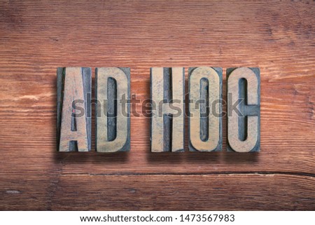ad hoc ancient Latin saying meaning - to this, combined on vintage varnished wooden surface 商業照片 © 