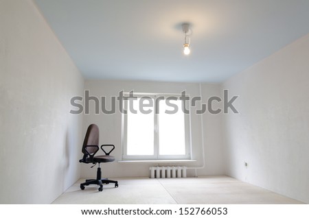 small home room under renovation with single office chair