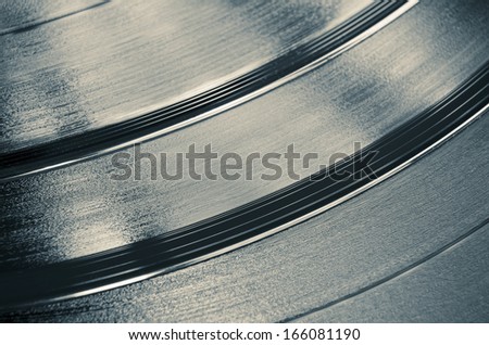 abstract vinyl disks fragment with selective focus on central disk