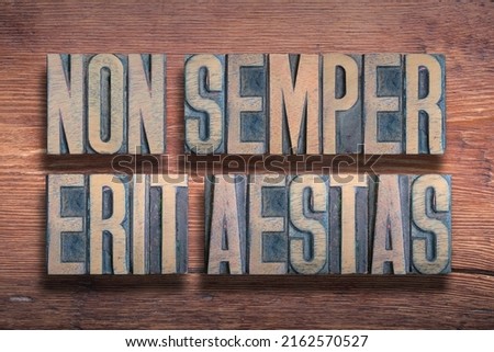 Non semper erit aestas (It will not always be summer) Latin phrase combined on vintage varnished wooden surface  Stok fotoğraf © 