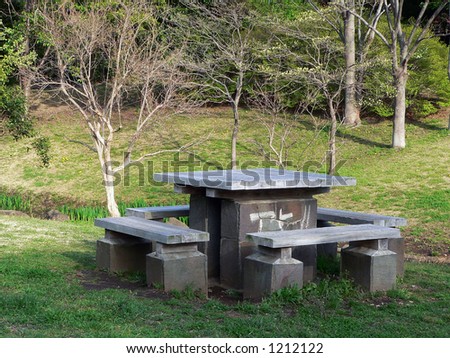 empty park benches and wooden table in park, Japan