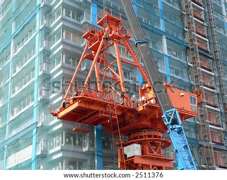 industrial construction crane and workers