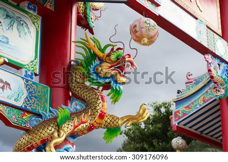 china dragon statue around the pole