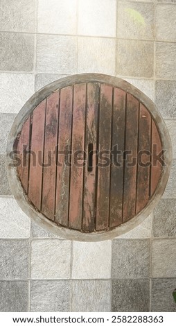 Similar – Image, Stock Photo round manhole cover on rain wet road