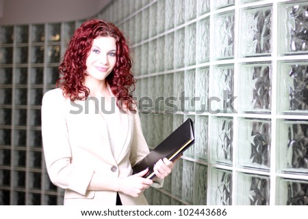 Young business woman at work in an office