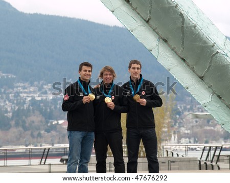 VANCOUVER - FEB 28: Speed Skating Men\'s Team Pursuit champions Mathieu Giroux, Lucas Makowsky & Denny Morrison with Olympic gold medals on February 28, 2010 in Vancouver, British Columbia, Canada
