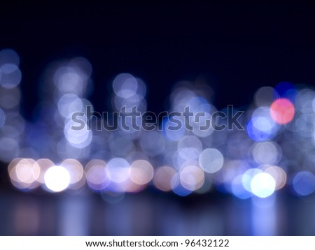 Blue City lights at night and reflection on water