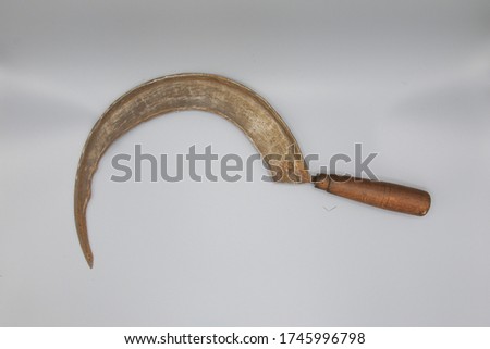 Antique hand sickle isolated on grey background ストックフォト © 