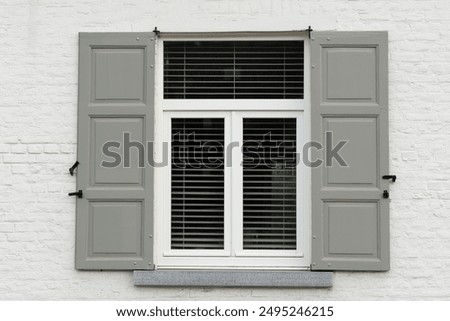 Similar – Image, Stock Photo Facades with white shutters in dark gray, orange and ocher against dramatic clouds